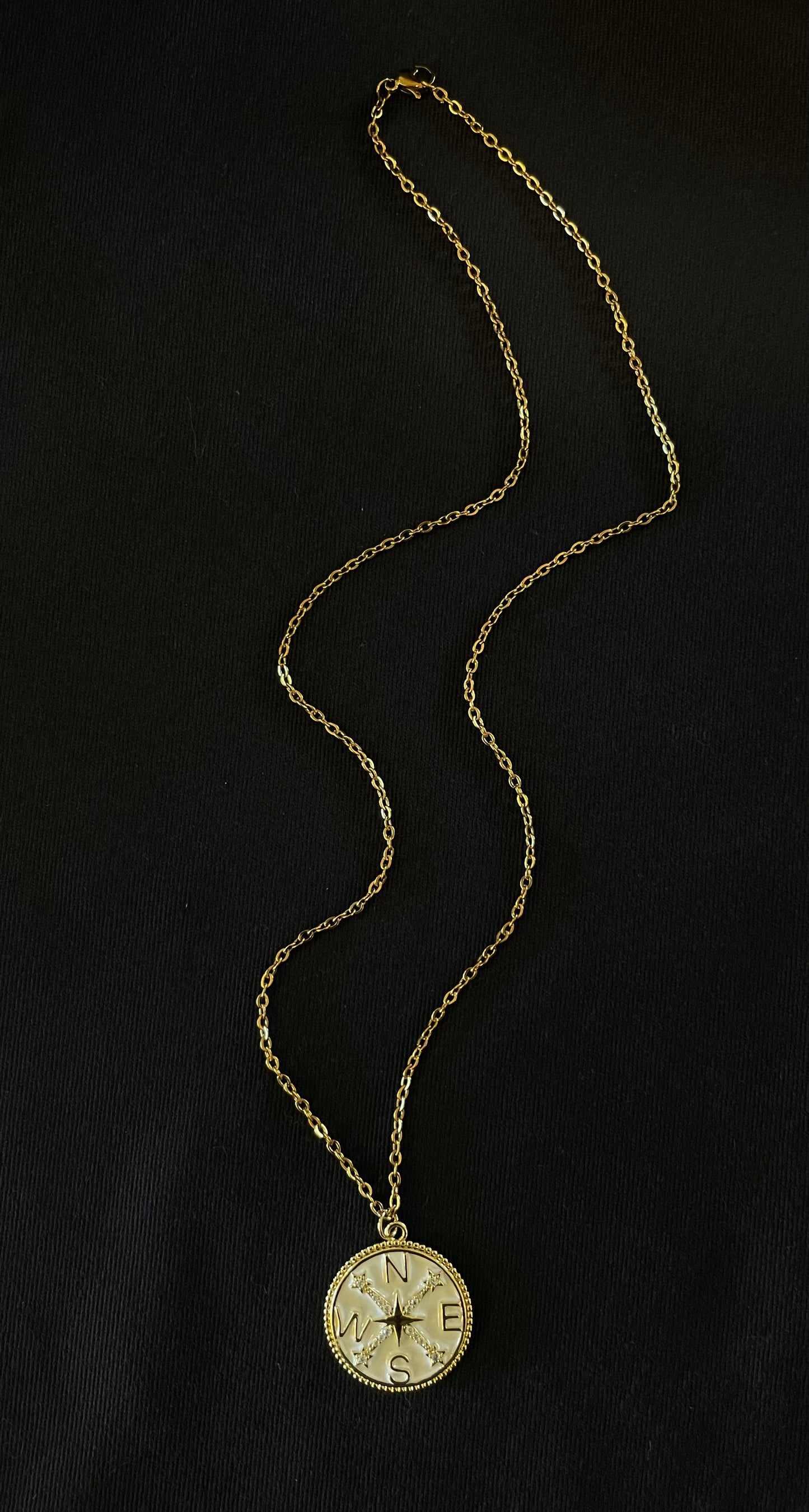 White compass rhinestone pendant